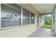 Inviting front porch with a view of the yard at 106 Oregon Ave, Saint Cloud, FL 34769