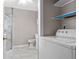 Bathroom with shower, toilet and washer/dryer at 106 Oregon Ave, Saint Cloud, FL 34769