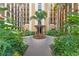 Lush tropical courtyard with a central walkway at 12556 Floridays Resort Dr # 207-A, Orlando, FL 32821