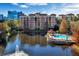 Resort-style community with pool, lake, and fountain at 12556 Floridays Resort Dr # 207-A, Orlando, FL 32821
