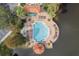 Community pool with surrounding deck and lounge chairs at 12556 Floridays Resort Dr # 207-A, Orlando, FL 32821