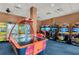 Fun game room featuring air hockey and arcade games at 12556 Floridays Resort Dr # 207-A, Orlando, FL 32821