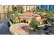Resort building with circular driveway and lakefront location at 12556 Floridays Resort Dr # 207-A, Orlando, FL 32821