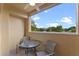Private balcony with outdoor seating and scenic views at 12556 Floridays Resort Dr # 207-A, Orlando, FL 32821