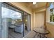 Private balcony with seating area and view overlooking a resort at 12556 Floridays Resort Dr # 207-A, Orlando, FL 32821