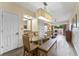Bright dining area with glass table and comfortable seating at 12556 Floridays Resort Dr # 207-A, Orlando, FL 32821