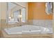 Bathroom with corner jacuzzi tub at 12556 Floridays Resort Dr # 207-A, Orlando, FL 32821