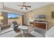 Spacious living room with comfortable seating and balcony access at 12556 Floridays Resort Dr # 207-A, Orlando, FL 32821