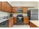 Updated kitchen with stainless steel appliances and granite counters at 12556 Floridays Resort Dr # 207-A, Orlando, FL 32821