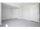 Bright bedroom with gray flooring and white doors at 168 E Sunset St, Groveland, FL 34736