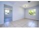 Light-filled dining area with tile floors and view to living room at 168 E Sunset St, Groveland, FL 34736