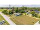 Aerial view showing a single-story house with a large yard and surrounding homes at 168 E Sunset St, Groveland, FL 34736