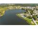 Aerial view of lakefront park with pavilion at 168 E Sunset St, Groveland, FL 34736