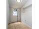 Small pantry with tile floor and exterior door at 168 E Sunset St, Groveland, FL 34736