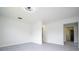 Open living room with gray vinyl flooring at 168 E Sunset St, Groveland, FL 34736