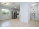 Bright dining area with tile floors and view into kitchen at 168 E Sunset St, Groveland, FL 34736