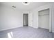 Bedroom with double door closet and window at 168 E Sunset St, Groveland, FL 34736