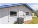 Rear exterior wall with AC unit and windows at 168 E Sunset St, Groveland, FL 34736