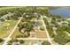 Aerial view showing a home's location near a lake and baseball field at 168 E Sunset St, Groveland, FL 34736