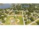 Aerial view showing home's location near park and residential area at 168 E Sunset St, Groveland, FL 34736