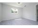Well-lit bedroom with large window at 168 E Sunset St, Groveland, FL 34736