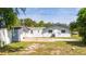Back of house showing shed and yard at 168 E Sunset St, Groveland, FL 34736