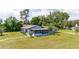 Aerial view of a single story home with large yard at 168 E Sunset St, Groveland, FL 34736