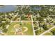Aerial view of a home near a park and residential neighborhood at 168 E Sunset St, Groveland, FL 34736