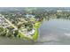 Aerial view of lakefront park and surrounding area at 168 E Sunset St, Groveland, FL 34736