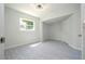 Well-lit bedroom with gray flooring and a closet at 168 E Sunset St, Groveland, FL 34736