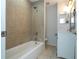 Clean bathroom with a tub and shower combo at 168 E Sunset St, Groveland, FL 34736
