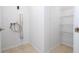 Laundry room with shelving and hookups for washer and dryer at 168 E Sunset St, Groveland, FL 34736