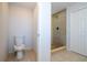 Updated bathroom with shower, toilet and tiled floor at 168 E Sunset St, Groveland, FL 34736