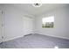 Bedroom with window and double-door closet at 168 E Sunset St, Groveland, FL 34736