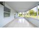 Spacious screened porch with tiled floor at 168 E Sunset St, Groveland, FL 34736