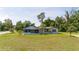 House with large yard and mature trees at 168 E Sunset St, Groveland, FL 34736