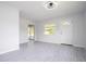 Bright living room featuring new flooring and sliding glass doors at 168 E Sunset St, Groveland, FL 34736