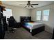 Bedroom with bed, desk and two windows at 2346 Upland Ln, Apopka, FL 32712