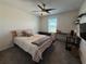 Bedroom with bed, desk, and ceiling fan at 2346 Upland Ln, Apopka, FL 32712