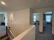 Hallway leading to two bedrooms with neutral decor at 2346 Upland Ln, Apopka, FL 32712