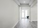Bright entryway with tile flooring and double doors leading to the backyard at 3198 Sailing Pier Ave, Winter Garden, FL 34787