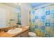 Bathroom with vanity, sink, and colorful shower curtain at 117 Troon Cir, Davenport, FL 33897