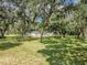 House and outbuildings nestled among lush greenery at 5311 Shady Oak N Dr, Lakeland, FL 33810