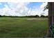 Partial view of a lush green golf course at 571 Saint Andrews Rd, Winter Haven, FL 33884