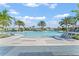 Resort-style pool with plenty of lounge chairs and palm trees at 1882 Walnut Creek Dr, Kissimmee, FL 34744