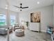 Bright office space with two armchairs, a large painting, and wood-look flooring at 3198 Sailing Pier Ave, Winter Garden, FL 34787