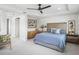 Spacious main bedroom with wood accent wall and en-suite bathroom at 3198 Sailing Pier Ave, Winter Garden, FL 34787