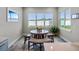 Bright breakfast nook with built-in bench seating and large windows at 3198 Sailing Pier Ave, Winter Garden, FL 34787