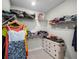 Large walk-in closet with ample shelving and hanging space at 3198 Sailing Pier Ave, Winter Garden, FL 34787