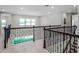 Bright hallway featuring windows overlooking the backyard at 3198 Sailing Pier Ave, Winter Garden, FL 34787